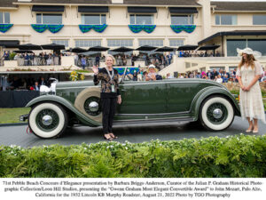 Woman standing in front of antique car in Pebble Beach